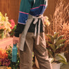 Person holding a bouquet of flowers in a floral setting