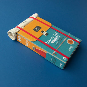 Colorful book with a rolled-up paper on a blue background