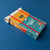 Colorful book with a rolled-up paper on a blue background