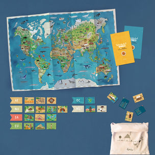 World map poster with educational cards and a tote bag on a blue background