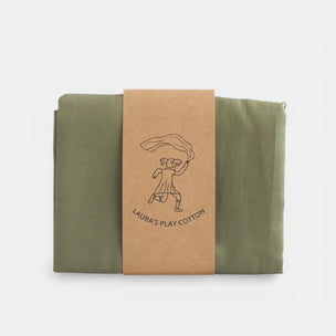 Green fabric folded and tied with a brown paper strap featuring 'Laura's Play Cotton' branding on a white background.
