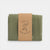 Green fabric folded and tied with a brown paper strap featuring 'Laura's Play Cotton' branding on a white background.