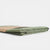Folded green fabric on a white background