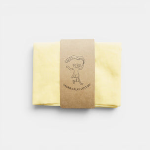 Packaged yellow fabric with a brown label on a white background