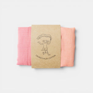Pink fabric swatch with a brown label on a light gray background