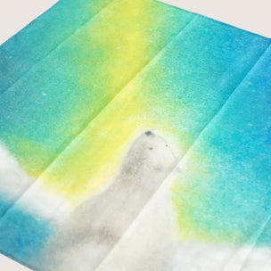 Polar bear illustration on a watercolor background with blue and yellow hues
