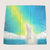Fleece blanket with a polar bear and aurora borealis design