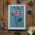 Floral painting on a wooden surface with real flowers around