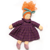 Doll with orange hair and a purple checkered dress on a white background