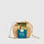 Wicker bag with a card labeled 'The Mini Pulley' on a light gray background