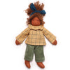 Doll wearing a yellow checkered coat and green pants on a white background