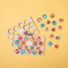 Colorful circular stickers on a yellow background