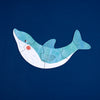 Children's shark puzzle on a dark blue background
