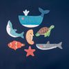 Set of ocean-themed puzzle pieces on a navy background