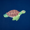 Turtle-shaped puzzle on a blue background