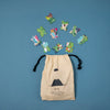 Puzzle pieces scattered around a beige drawstring bag on a blue background