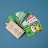 Set of colorful greeting cards with various designs on a blue background