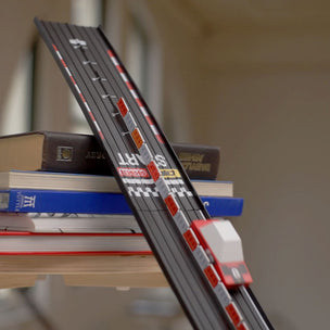 Model road set set on a stack of books with a blurred background