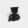 Black plush toy cat on a light gray background