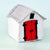 A small handmade felt house toy or decoration with a white body, gray roof, and bright red door outlined in black, shown on a pale blue background.