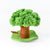 A small felt tara treasures tree decoration with bright green textured foliage, a brown trunk, a green base, and a hanging brown swing, photographed on a clean white background.