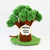 A handmade felt sheep tree toy with green yarn-style leaves, a brown felt trunk, a green felt base, and a hanging swing. A cream-colored tag on the trunk reads 'Shaun the Sheep' with a cartoon sheep logo.