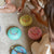 Children playing with colorful drums on a carpeted floor