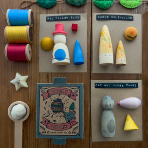 Collection of wooden toys and items on a wooden surface