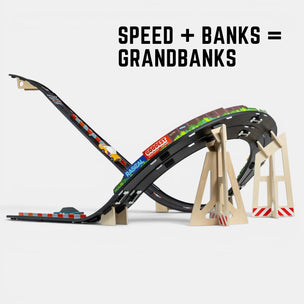 Toy car track set with a bridge and text 'SPEED + BANKS = GRANDBANKS' on a white background