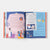 Open book with colorful illustrations and text on Eid Al-Fitr