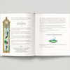 Open book with illustrated pages on a gray background