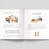 Open book with illustrated pages and text on a gray background