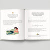 Open book with text and illustration of a girl by a pond on a gray background