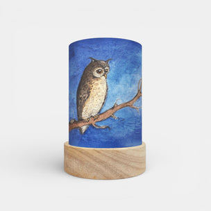 Cylindrical lamp with an owl design on a blue background