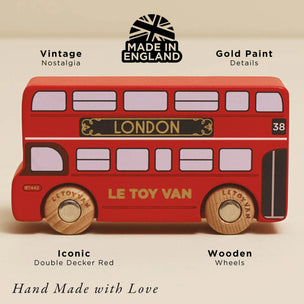 Red double-decker toy bus with gold paint details, made in England by Le Toy Van.