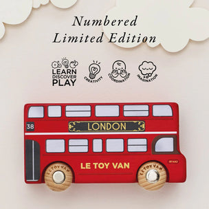 Red toy bus with 'Le Toy Van' branding on a light background