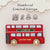 Red toy bus with 'Le Toy Van' branding on a light background