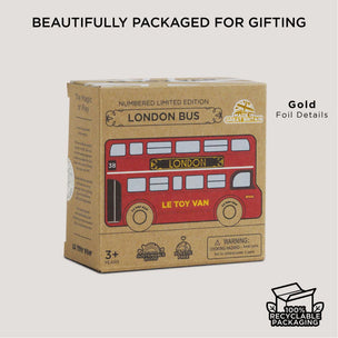 Box packaging of a toy London bus by Le Toy Van on a beige background