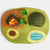 Felted landscape with a campfire, hedgehog, and pond on a gray background