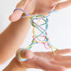 hands playing with colourful string
