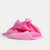 Laura's cotton play cloth Pink fabric with a bow on a light gray background