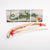 Wooden bow and arrow set with red nocks against a dragon-themed background