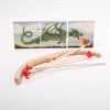 Wooden bow and arrow set with red nocks against a dragon-themed background