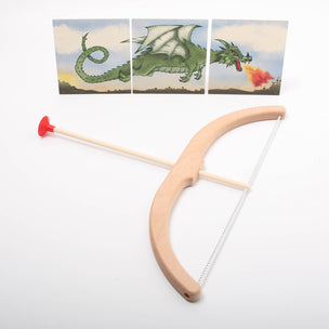 Wooden bow and arrow set with dragon-themed cards on a white background
