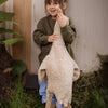 Girl with large linen goose