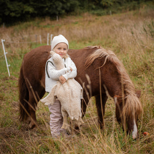 girl with horse and large linen goose 