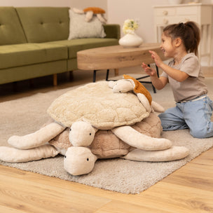 girl with pile of turtles