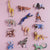 Set of colorful animal figurines on a pink background