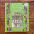 Green 'Brambly Hedge Jigsaw Book' on a wooden surface