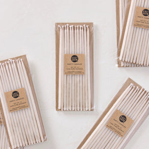 Packaged candles on a white background